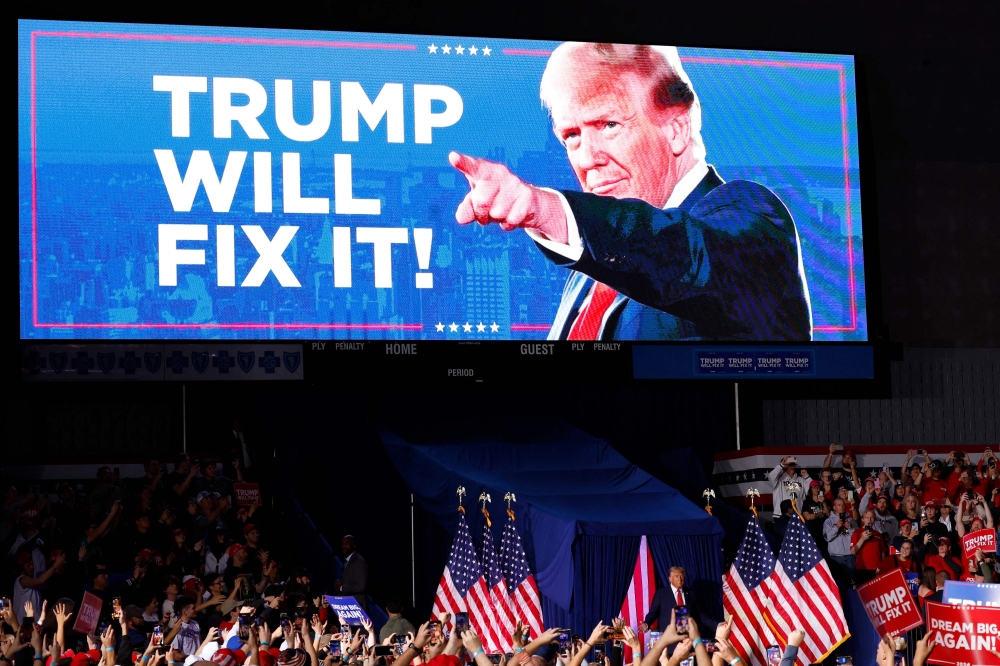 Republican Donald Trump making a final pitch to supporters in Michigan. — AFP pic 