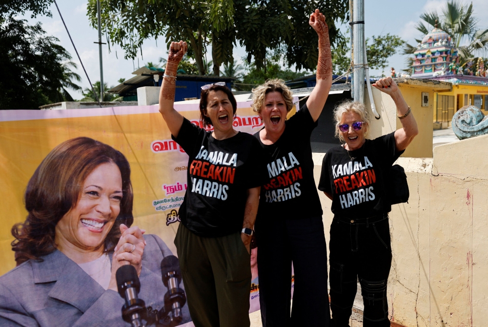 Supporters of Democratic presidential nominee and U.S. Vice President Kamala Harris cheer for her beside a poster in Thulasendrapuram, the village where Harris' maternal grandfather was born, in the Southern state of Tamil Nadu, India November 5, 2024. — Reuters pic