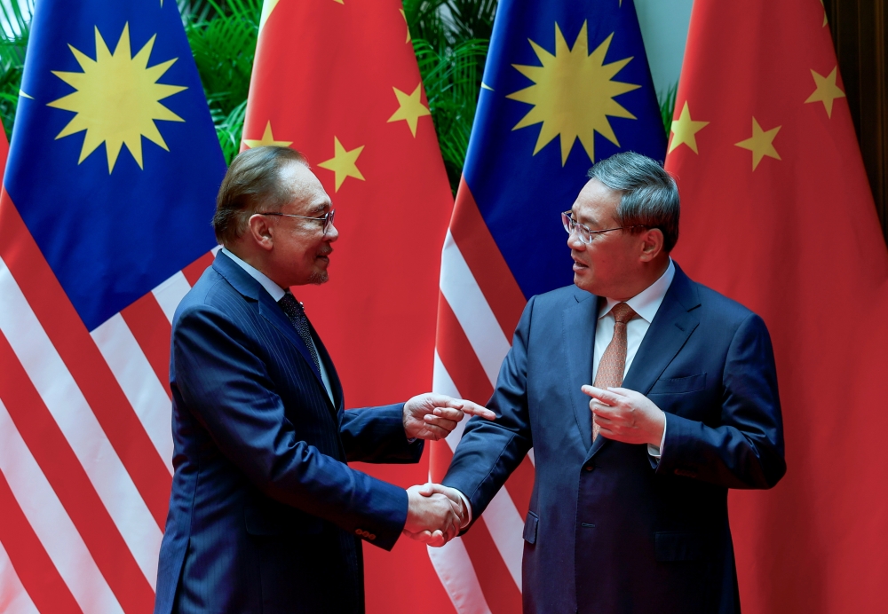 Prime Minister Datuk Seri Anwar Ibrahim meets his Chinese counterpart, Premier Li Qiang at The Grand Halls in Shanghai. Nov 5, 2024. — Bernama pic