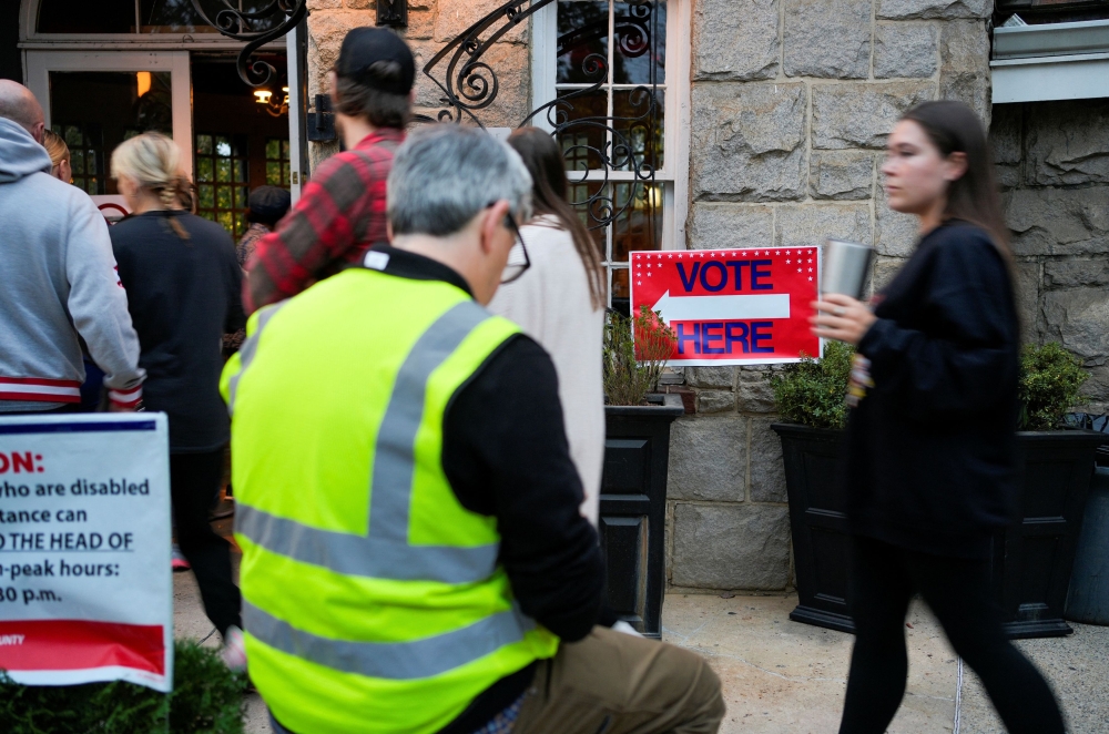 Early vote returns in US battleground states may not be a good indicator of whether Democratic candidate Kamala Harris or Republican rival Donald Trump will win, experts say, thanks to vote counting rules and quirks in several key states. — Reuters pic