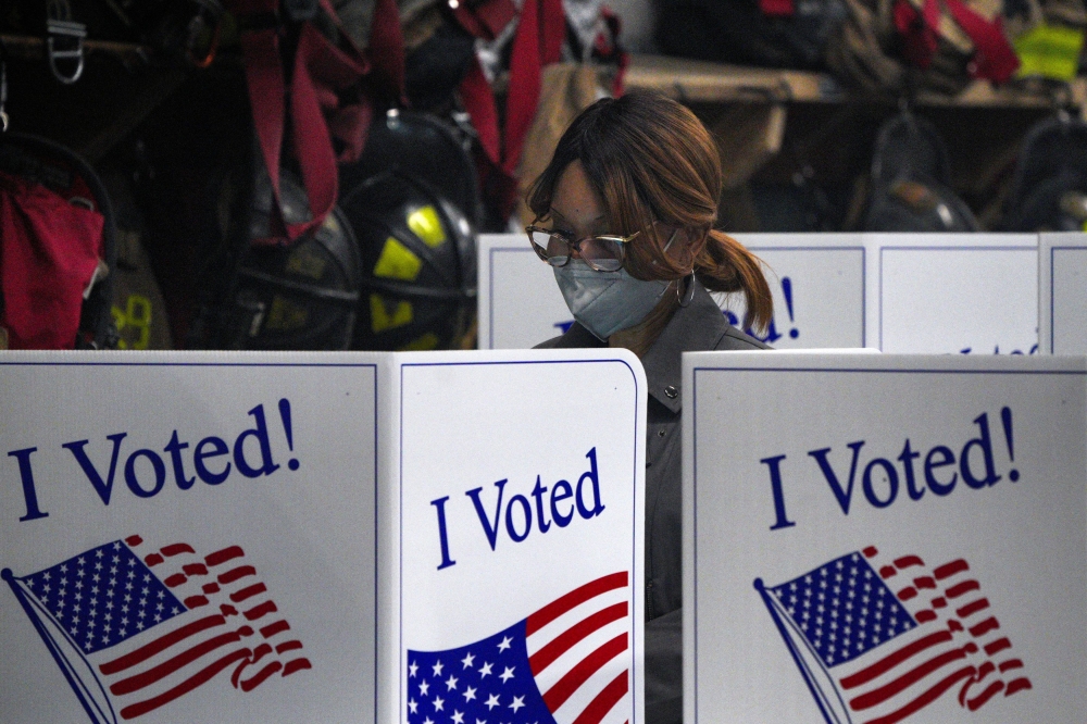 A person votes at Engine Company 15 during the 2024 US presidential election on Election Day, at a library in Pittsburgh, Pennsylvania November 5, 2024. — Reuters pic