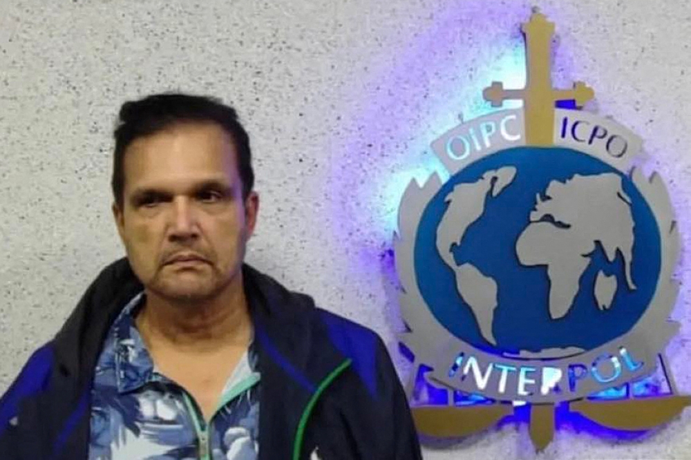 This undated handout picture released on September 21, 2022 by the Instagram account of Interpol Venezuela shows Malaysian fugitive Francis Leonard Glenn, known as “Fat Leonard”, after his capture in Maiquetia, Venezuela. — AFP pic