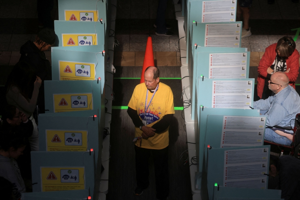 An election worker oversees voting process in the 2024 US presidential election on Election Day at a polling station in Henderson, Nevada November 5, 2024. — Reuters pic 