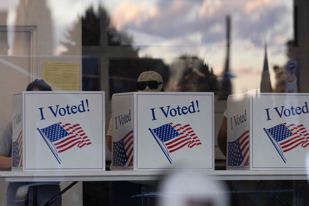 American complete their ballots in Pittsburgh, Pennsylvania, on November 5, 2024. — AFP pic