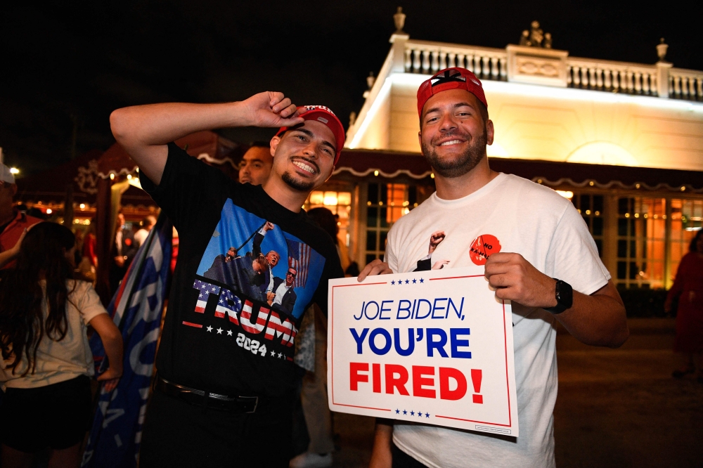 Supporters of former US President and Republican presidential candidate Donald Trump await election results outside Versailles Cuban restaurant in Miami, Florida, November 5, 2024. — AFP pic