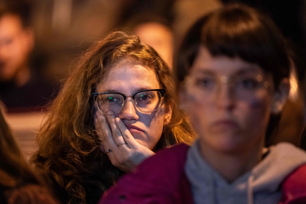 People watch as results are reported at an election watch party in the Mission District of San Francisco November 5, 2024. — AFP pic