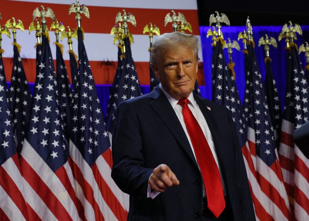 Republican presidential nominee and former US president Donald Trump takes the stage to address supporters at his rally in West Palm Beach, Florida, November 6, 2024. — Reuters pic