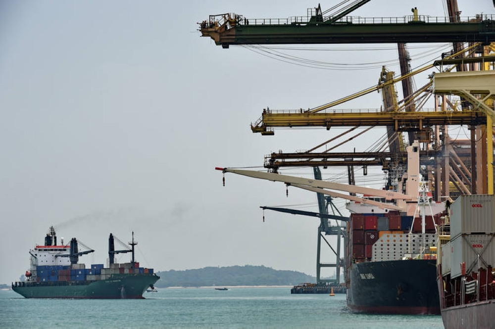 The spill, which released around 400 tonnes of fuel into the sea, occurred when the dredger collided with the stationary Singapore-flagged bunker vessel Marine Honour at Pasir Panjang Terminal. — AFP pic