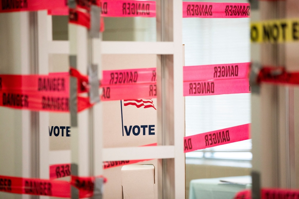 Hoax bomb threats, many of which appeared to originate from Russian email domains, were directed yesterday at polling locations in five battleground states - Georgia, Michigan, Arizona, Wisconsin and Pennsylvania. — Reuters pic