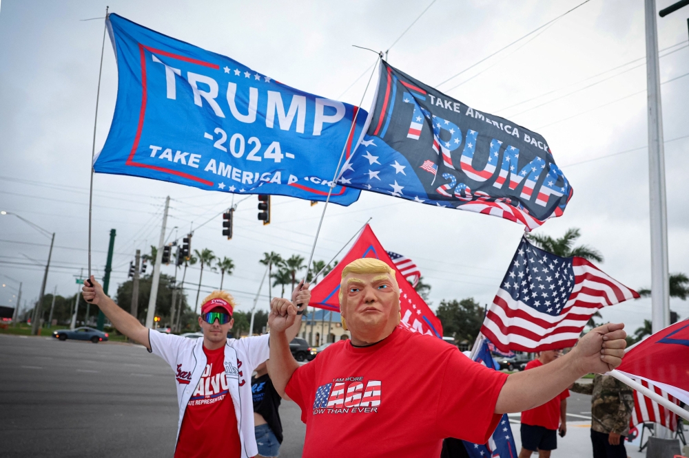 Supporters of US President-elect Donald Trump react, after he won the 2024 US presidential election, in West Palm Beach, Florida, November 6, 2024. — Reuters pic