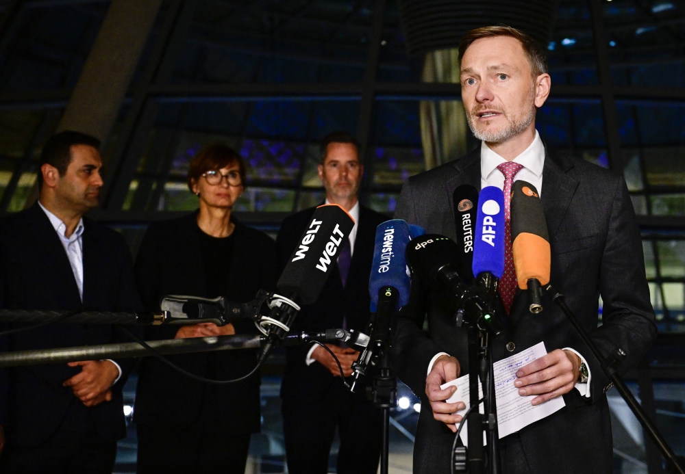 German Finance Minister Christian Lindner addresses a press conference at the Reichstag building which houses Germany's lower house of parliament (Bundestag) in Berlin after a coalition committee meeting on November 6, 2024. — AFP pic