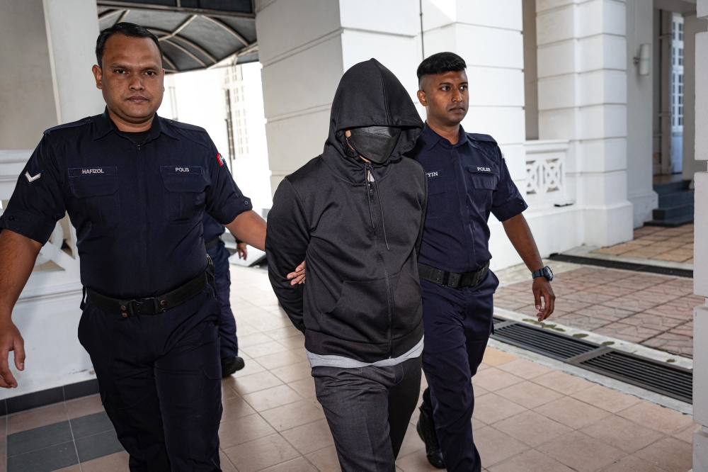 Senior police officer Mohd Nazri Abdul Razak, 44, arrives at the High Court in Ipoh on the third day of the murder case trial against him November 7, 2024. — Bernama pic