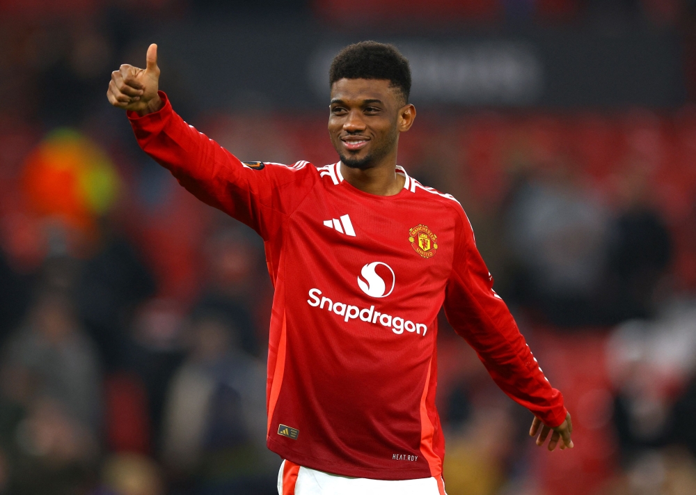 Thumb up! Manchester United's Amad Diallo celebrates after the match. — Reuters