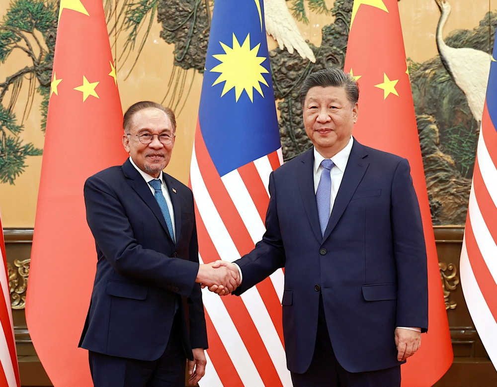 Chinese President Xi Jinping meets Malaysian Prime Minister Anwar Ibrahim at the Great Hall of the People in Beijing, China November 7, 2024. — Reuters pic