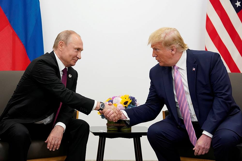 Vladimir Putin and Donald Trump in a file photo taken during a bilateral meeting at the G20 leaders summit in Osaka, Japan in 2019. — Reuters