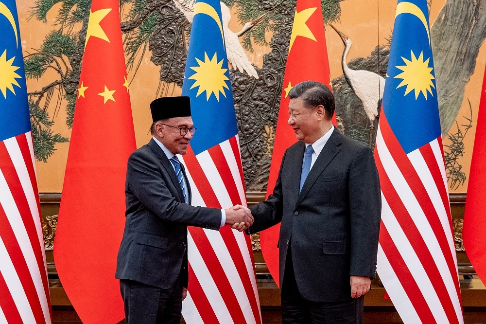 Prime Minister Datuk Seri Anwar Ibrahim and Chinese President Xi Jinping shake hands during their meeting in Beijing March 31, 2023. — Picture courtesy of Prime Minister’s Office of Malaysia/Sadiq Asyraf