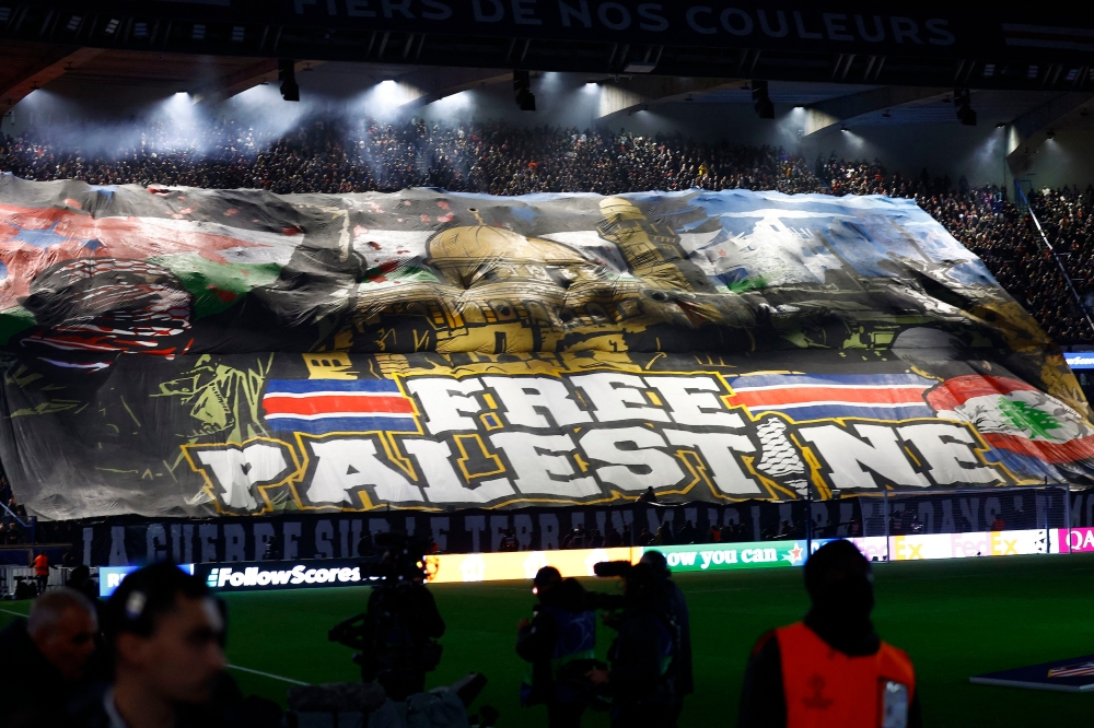 A banner on support of Palestine is displayed in the stands before the Uefa Champions League match between Paris St Germain and Atletico Madrid in Paris November 6, 2024. — Reuters pic