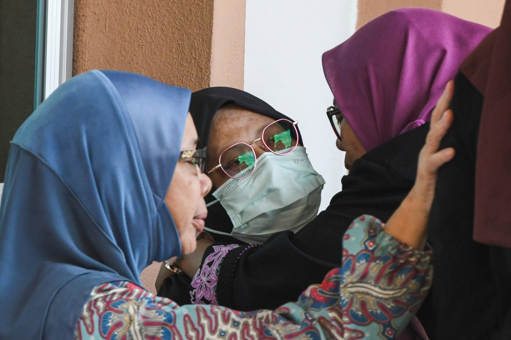 The wife and mother of the two victims who died in a tragic stabbing incident, known as Khalida in her 60s, comes to terms with the loss of her two loved ones simultaneously. — Bernama pic