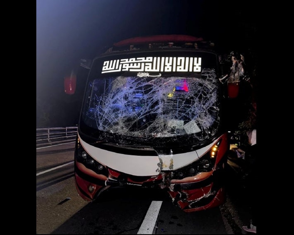 A tour bus carrying 41 people collided with a trailer along the North-South Expressway near Gopeng early this morning. — Picture courtesy of the Fire and Rescue Department 