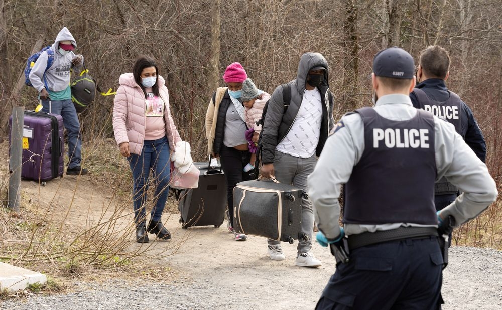 Asylum seekers cross into Canada from the US border near a checkpoint on Roxham Road near Hemmingford, Quebec, Canada April 24, 2022. — Reuters pic