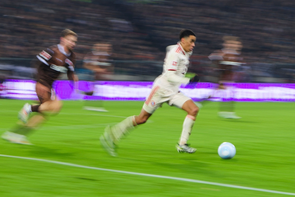 An incredible long-range goal from Jamal Musiala took Bayern Munich five points clear at the top of the Bundesliga table with a 1-0 win at St Pauli. — AFP pic