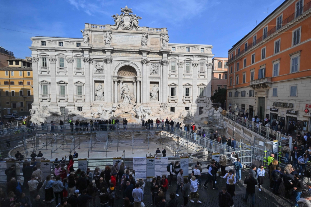 A photo shows a panoramic view of the Trevi Fountain as it undergoes renovation works, during the presentation of the public’s temporary walkway and the basin in front to give tourists the chance to throw a coin and make a wish as per tradition, in Rome, on November 9, 2024. — AFP pic