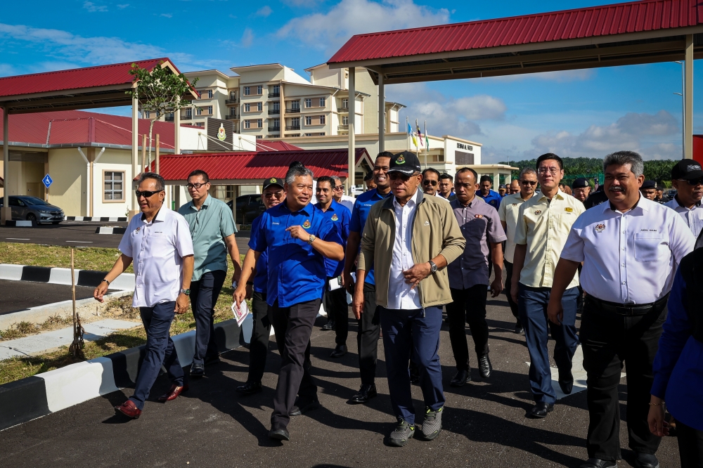 Home Minister Datuk Seri Saifuddin Nasution Ismail (third from right) spoke to reporters after witnessing the handover of the Jawi Immigration Depot and Quarters in Nibong Tebal, Penang on November 10, 2024. — Bernama pic