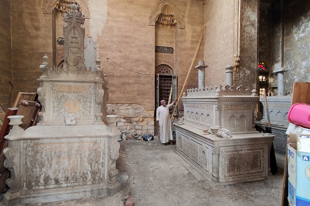 A man stands inside the tomb of the el-Meligui family, prior to its demolition in a historic Cairo cemetery that will be partially razed to accommodate the growing mega-city, on November 6, 2024. The Egyptian government says the destruction of cemeteries in Cairo is necessary to build new roads and bridges that they hope will improve traffic in the congested, densely-populated capital, home to around 22 million people. — AFP pic