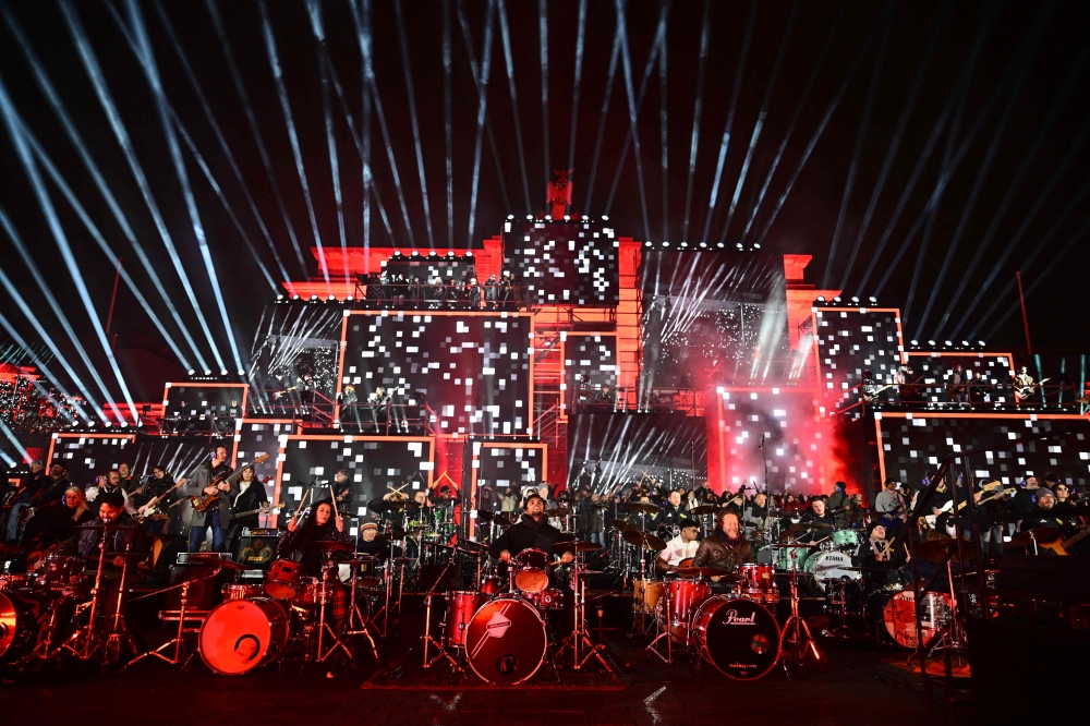 Musicians play on stage during the ‘Konzert für Freiheit’ (concert for freedom) for the 35th anniversary of the fall of the Berlin Wall, on November 9, 2024 at the Brandenburg Gate in Berlin. — AFP pic