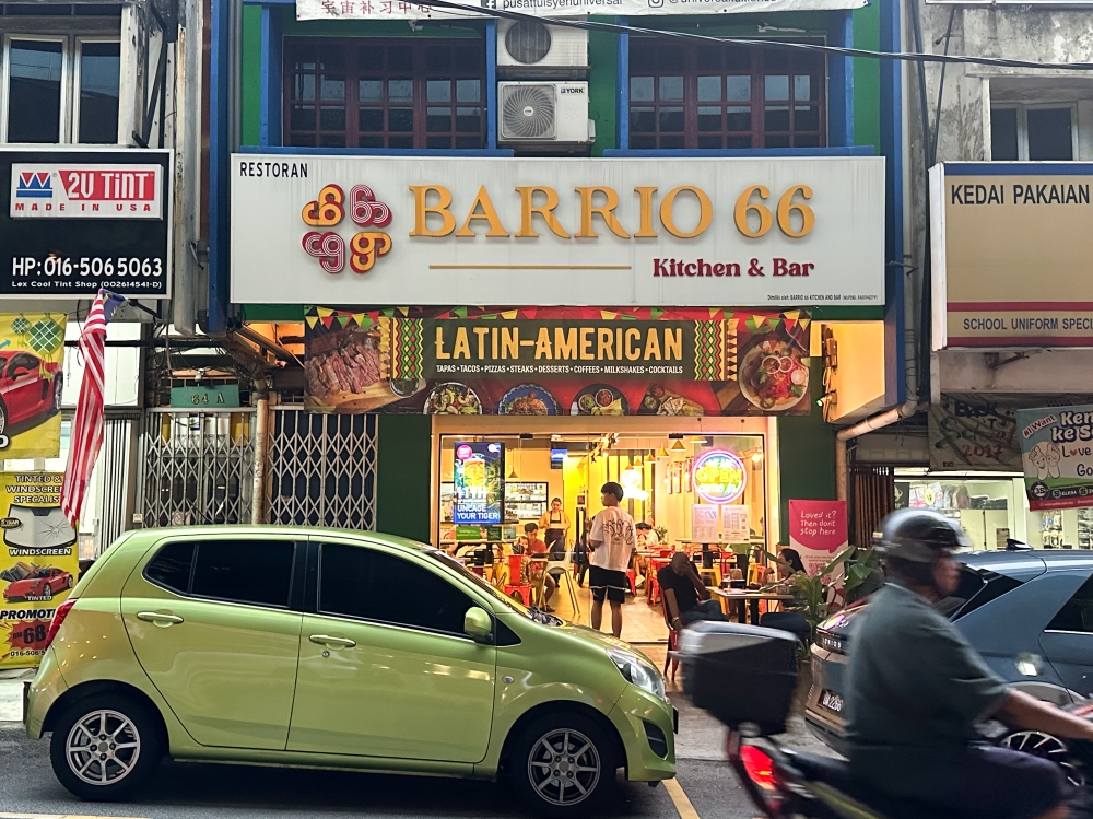 It can be hard to spot Barrio 66 amid all of the car repair shops that line this street, but it is right opposite the Taman Midah MRT station. — Picture by Lee Khang Yi