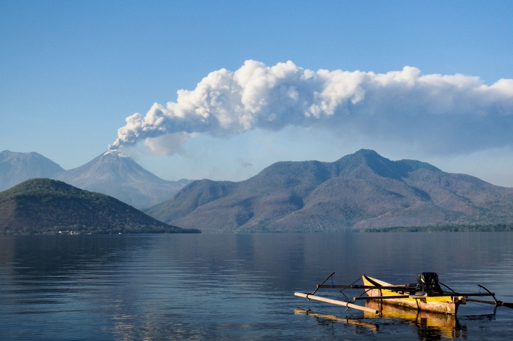 Mount Lewotobi Laki Laki spews ash and smoke during an eruption as seen from Lewolaga village in Titihena, East Nusa Tenggara, on November 13, 2024. — AFP pic