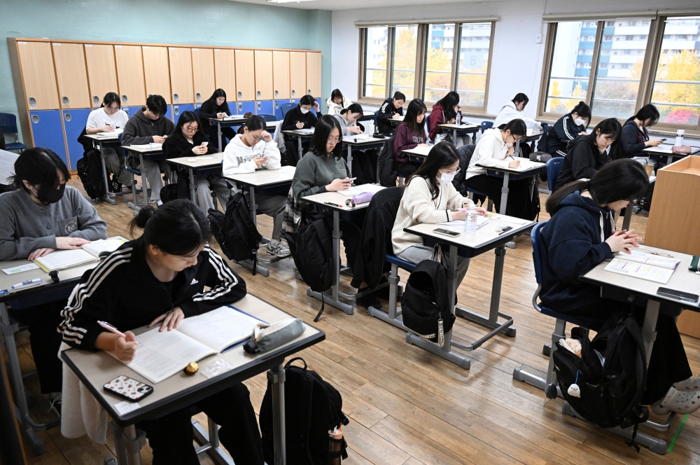 South Korean students prepare for the annual College Scholastic Ability Test, known locally as Suneung, at a school in Seoul on November 14, 2024. — AFP pic