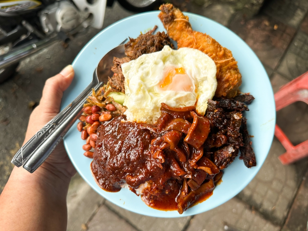 Build a plate of happiness at Nasi Lemak Ujang where the star is the tender beef ‘rendang’.