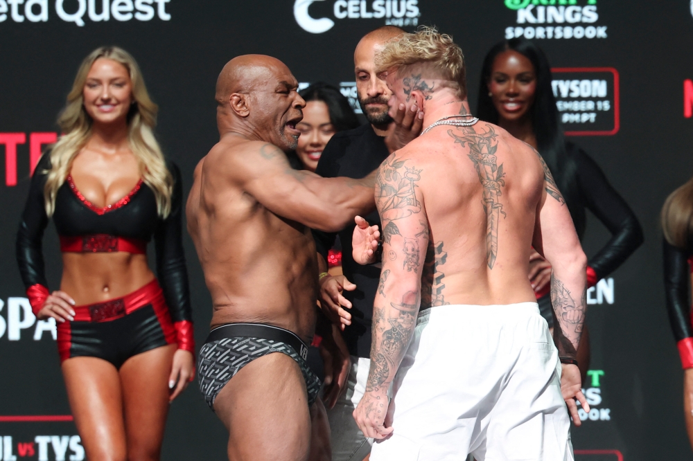 Mike Tyson slaps Jake Paul after weighing in at the Toyota Music Factory. — Kevin Jairaj-Imagn Images pic via Reuters