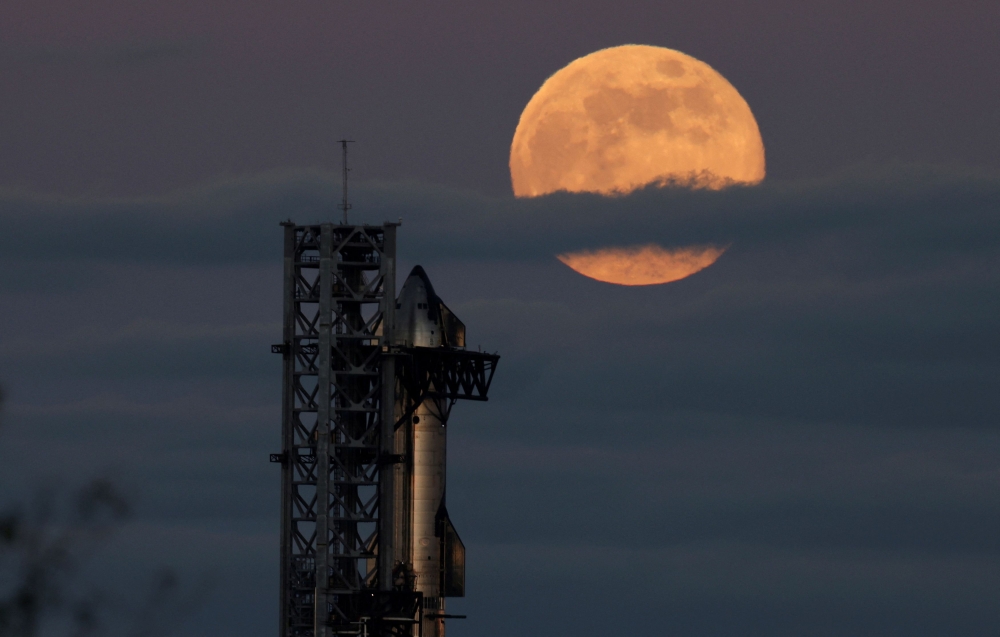 SpaceX’s next-generation Starship spacecraft atop its powerful Super Heavy rocket is prepared for launch as the Beaver moon rises, the final supermoon of the year, at the company’s Boca Chica launchpad, in Brownsville, Texas November 15, 2024. — Reuters pic  