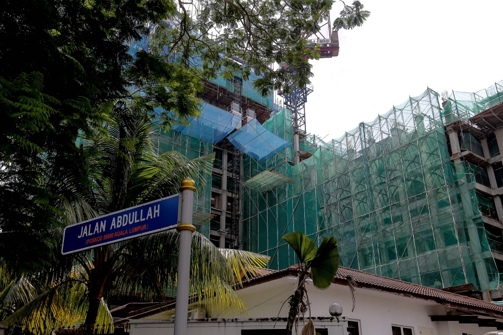 Despite the narrow dual-carriageway, buildings continue to be constructed at Jalan Abdullah in Bangsar, Kuala Lumpur, adding to the congestion. — Picture by Sayuti Zainudin