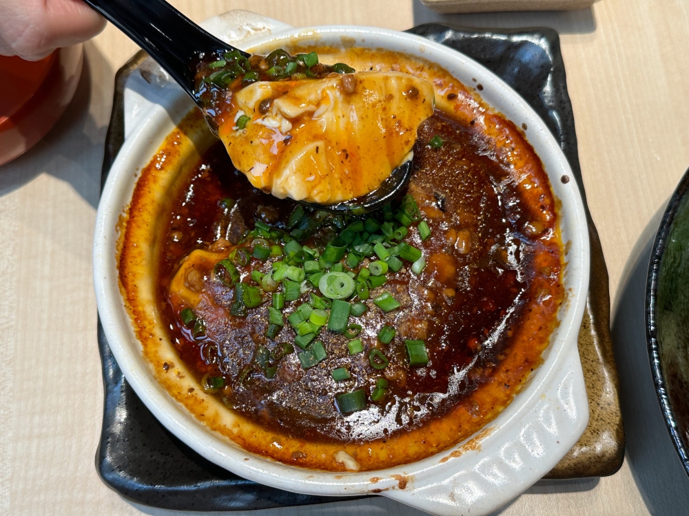 Mapo Tofu may look fiery but it’s more fragrant sauce goes well with smooth tofu and a bowl of rice.