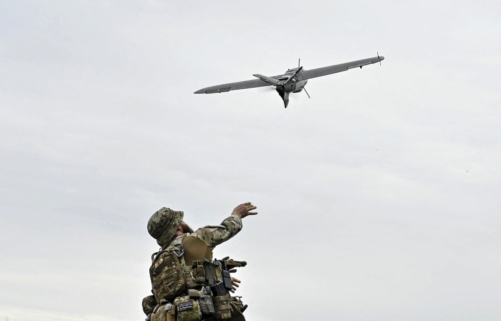 A Ukrainian serviceman launches a reconnaissance drone for flying over positions of Russian troops, amid Russia's attack on Ukraine, in Zaporizhzhia region, Ukraine May 26, 2024. — Reuters pic