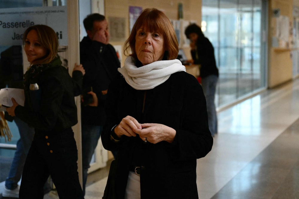 Gisele Pelicot leaves the courthouse after a hearing in the trial of her former partner Dominique Pelicot accused of drugging her for nearly ten years and inviting strangers to rape her at their home in Mazan, a small town in the south of France, in Avignon, on November 18, 2024. — Reuters pic  