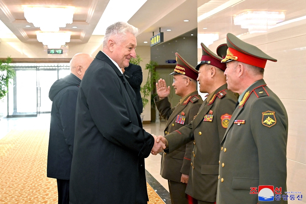 This picture taken on November 18, 2024 and released from North Korea’s official Korean Central News Agency (KCNA) via KNS on November 19, 2024 shows Russia’s Colonel General Vladimir Zarudnitsky (left) being welcomed upon his arrival at Pyongyang International Airport for a visit in Pyongyang. — KCNA pic via KNS/AFP