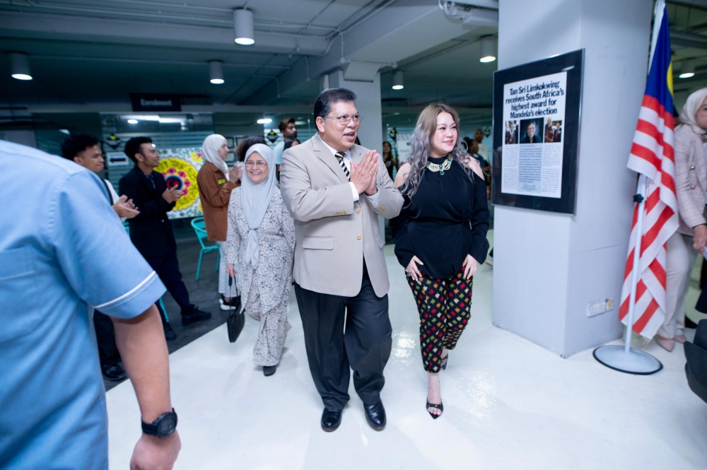 Dewan Rakyat Speaker Tan Sri Johari Abdul is given a tour of Limkokwing University by Datuk Tiffanee Marie, Group Chief Brand Officer, during the Commonwealth Student Governance Summit 2024. — Picture by Limkokwing University.