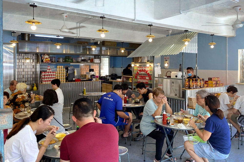 Lunchtime crowd enjoying their meal.