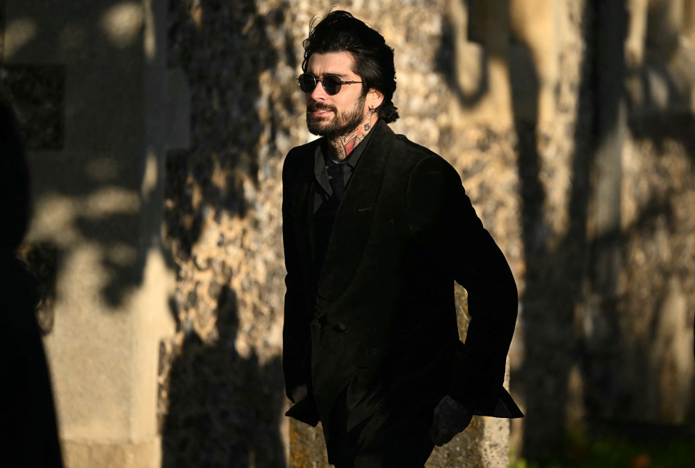 Former One Direction band member Zayn Malik leaves after attending the funeral service of the late One Direction singer Liam Payne. –– AFP pic