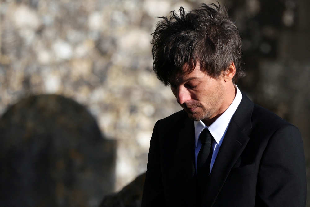 Louis Tomlinson departs after the funeral of former One Direction singer Liam Payne at St Mary’s Church in Amersham, near London. –– Reuters pic