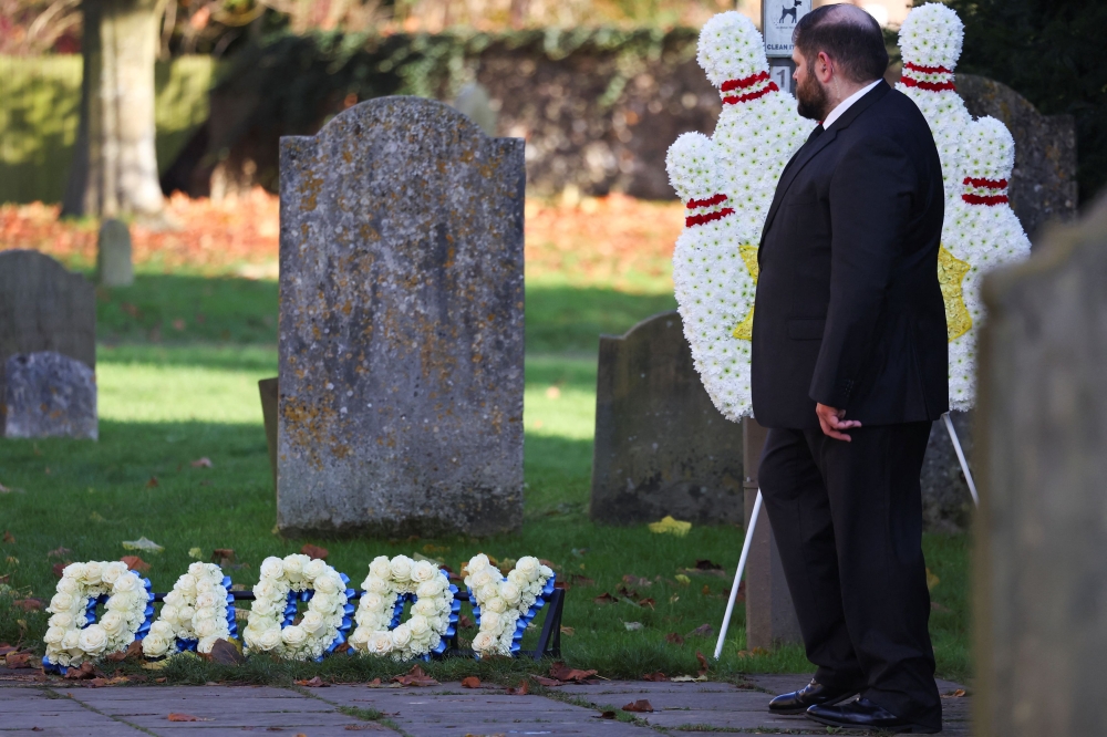 Themed floral tributes for former One Direction singer Liam Payne are seen outside St Mary’s Church on the day of his funeral, in Amersham, near London, Britain, November 20, 2024. –– Reuters pic