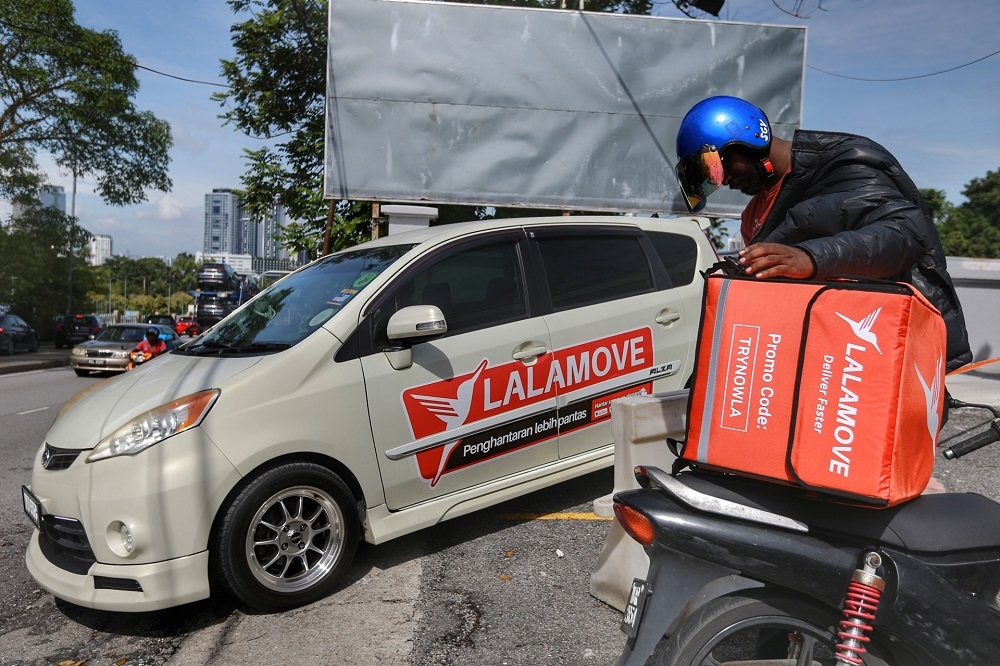 Lalamove now offers e-hailing service, and may benefit from their existing customer base. — Picture by Ahmad Zamzahuri