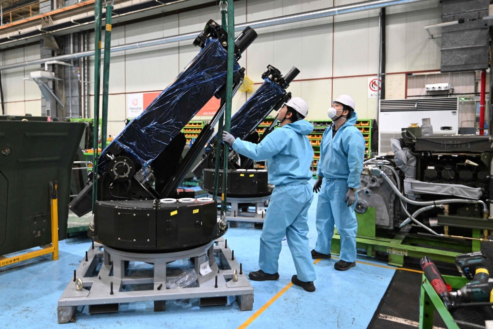 South Korean engineers work on a 120mm self-propelled mortar at Hanwha Aerospace factory in Changwon . — AFP pic