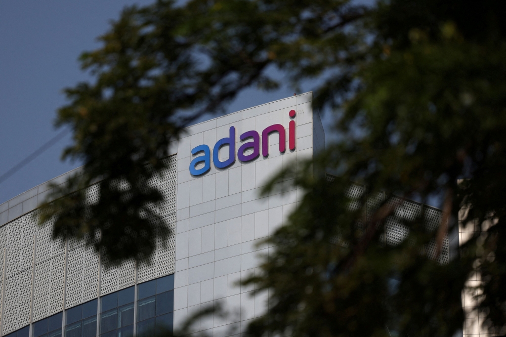 The logo of the Adani Group is seen on the facade of its Corporate House on the outskirts of Ahmedabad, India, November 21, 2024. — Reuters pic