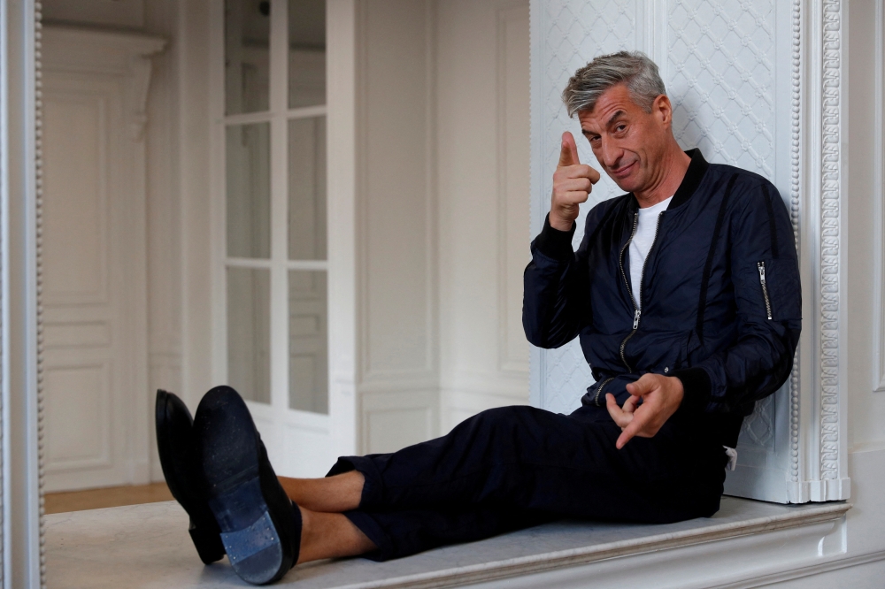 Italian artist Maurizio Cattelan poses prior to the opening of the exhibition 