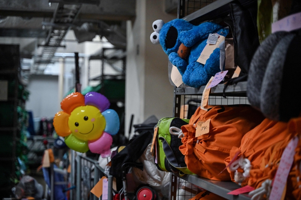 Soft toys, forlorn suitcases and a forest of umbrellas: Welcome to Tokyo’s vast police lost-and-found centre, where everything is meticulously tagged and sorted to hasten a return to its rightful owner. — AFP pic